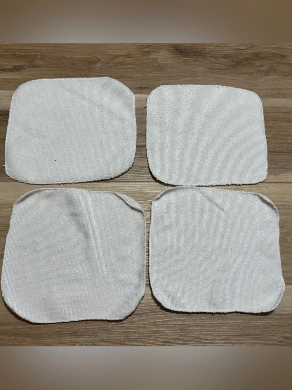 4 White baby wash cloths